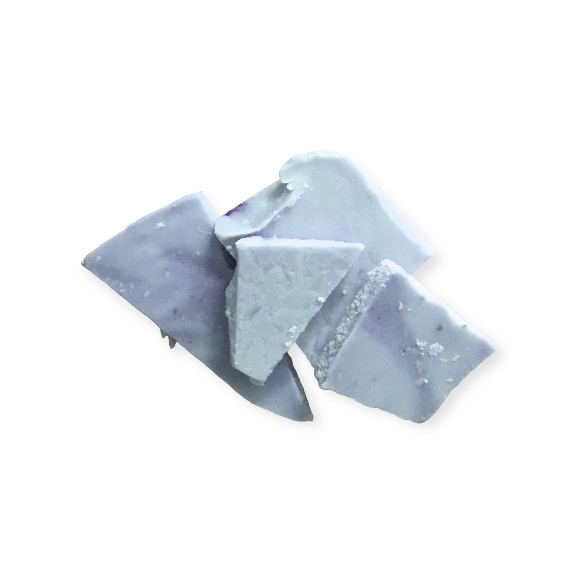 Pale blue soy wax melts in bark form on a white background