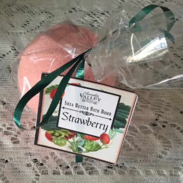 Strawberry bath bomb packaged with decorative label